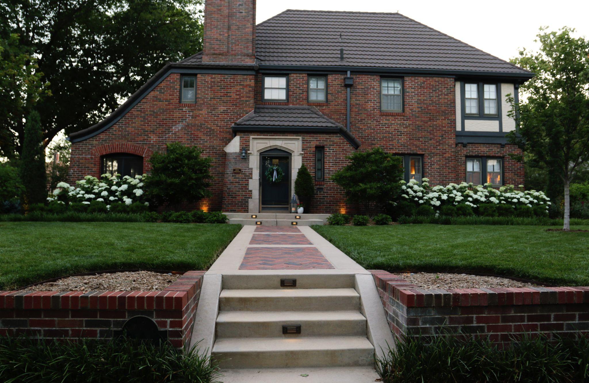 Brick home with landscaped front walkway